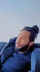 A candid, relaxed moment featuring Jack Donnovan outdoors. He is seen lounging comfortably, dressed in a dark blue sweater and black jacket against a clear sky. The scene captures a peaceful, personal vlog-style snapshot of his day. by @jackdonnovan with Original Sound by jackdonnovan