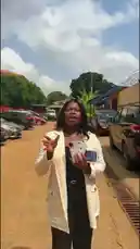 A woman promotes a limited-time Ghana promo. By showing your Ghana card and making a 40% or 50% down payment, you can buy any phone and get either a free charger or AirPods. Don't miss out on this month's offer! by @ab_god18 with Original Sound by ab_god18