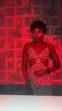 This short clip features Bene Sassy posing confidently in a stylish leopard print dress against a textured wall bathed in dramatic red light. She performs subtle, elegant movements, showcasing her outfit and presence. by @be-sassyish with California King Bed (Album Version) by Rihanna