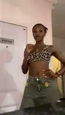 In this captivating clip, Nigerian social media sensation Bene Sassy performs a dynamic dance routine in front of a 'Staff Only' door. She wears a stylish leopard print crop top and high-waisted jeans with floral details, showcasing her energetic choreography and confident personality. This performance is part of a trending dance challenge, highlighting the viral nature of short-form content. by @be-sassyish with Original Sound by be-sassyish