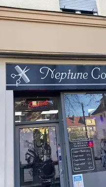 This video provides a first-person tour of Neptune Coiffure, a contemporary hair salon. It begins with an exterior view of the shop, showcasing its stylish signage and service menu. The camera then moves inside, revealing a clean, modern interior with wooden floors and a reception desk adorned with a potted plant. A prominent Instagram NFC sign invites customers to connect via their phones, highlighting the salon's integration of social media and technology. by @amh-boost with amh-boost by Original Sound