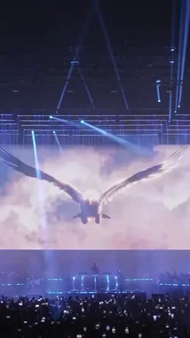 Experience the electrifying atmosphere of a Tiesto live concert. Witness the massive crowd, the dazzling blue laser lights crisscrossing the arena, and the mesmerizing holographic bird soaring above the stage. This high-energy performance captures the essence of a modern EDM spectacle. by @tiesto with Original Sound by tiesto