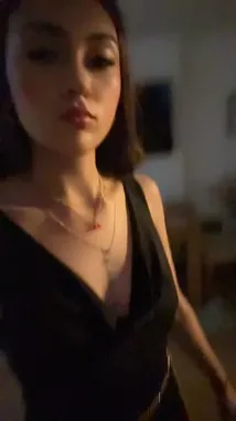 In this stylish clip, Amberrr🫶🏻 showcases a chic black V-neck dress paired with elegant gold accessories. The outfit features a delicate chain belt and layered necklaces, including a red clover pendant. She carries a shimmering gold handbag, completing her glamorous look. The dim lighting highlights the textures and details of her ensemble, creating a captivating fashion moment perfect for fans of trendy street style and celebrity-inspired looks. by @amberrrlaw with amberrrlaw by Original Sound