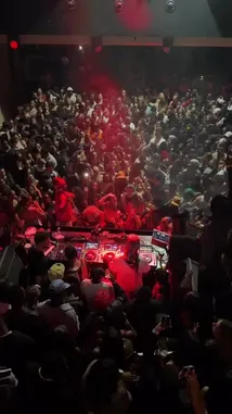 Experience the electrifying atmosphere of DJ SPINALL's sold-out EkoGrooveTour show in Madrid. This high-energy performance features a massive crowd dancing under intense red lights and smoke, creating an unforgettable live concert experience. by @djspinall with djspinall by Original Sound