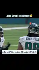 This video highlights Philadelphia Eagles defensive tackle Jalen Carter's impressive first-half performance against the Jaguars. On-screen text details his stats: 4 tackles, 2.0 sacks, 3 tackles for loss (TFL), and 2 forced fumbles. The footage shows Carter interacting with teammates Baun and another player on the field, capturing a moment from the game. by @eagles with Original Sound by eagles
