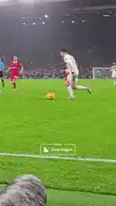 A Manchester United player scores a goal during a Premier League match, but immediately collapses in pain near the sideline. Teammates rush to his aid as medical staff attend to him. After receiving treatment, he gets back on his feet, celebrates with fans, and raises his finger to the sky, showcasing resilience. by @manutd with Original Sound by manutd