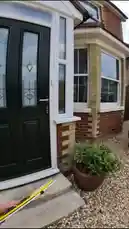 A car enthusiast named Callum approaches a homeowner to ask permission to photograph his stunning black BMW M5 parked in the driveway. After a friendly conversation, the owner, Charles, grants him access. The camera then showcases the car's pristine condition, including its sparkling engine bay and new exhaust system, highlighting the passion behind classic car ownership. by @nergizeauto with Original Sound by nergizeauto