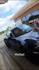 A car enthusiast named Callum approaches a man at a Shell gas station who is driving a blue Porsche 718 Cayman. After gaining permission, he takes photos of the car from various angles while they have a friendly chat about their shared passion for manual transmission sports cars. The conversation reveals the driver's long-standing love for cars, which began in childhood. This real-life interaction showcases how to respectfully engage with fellow car lovers. by @nergizeauto with Original Sound by nergizeauto