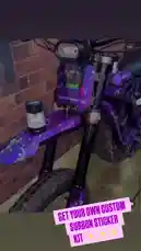 This fast-paced, visually stunning showcase from PACK'D | DESIGN | PRINT | reveals a custom-designed purple electric bike adorned with a vibrant 'Chroma' sticker kit. The camera sweeps around the vehicle, highlighting its unique graphics, sleek frame, and modern components against a brick wall backdrop. A persistent call-to-action overlay encourages viewers to get their own custom sticker kit, positioning the product as a simple upgrade for personalizing their ride. by @pack.d with Original Sound by Contains: Habits (Stay High) - Tove Lo