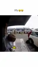 A woman in a red coat bends over her car in a residential driveway. A man in a grey hoodie walks past, picks up a penny from the ground, and then dramatically pretends to throw it into the car. The woman turns around, and the man immediately bends down to pick up another penny he had just dropped. It's all part of a classic prank where you're supposed to 'pass it to a friend' for good luck, but the twist is that the 'friend' is just you! This funny moment captures the playful spirit of pranks and superstitions. by @uk-gos with Original Sound by uk-gos
