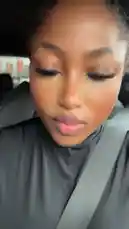 In this candid car selfie, Dhikrot 💗 showcases her chic style while driving. She's wearing a sleek black top and patterned pants, accessorized with statement earrings. With a playful expression and a hand through her hair, she captures a moment of confidence and everyday glamour. by @miji-bello with Original Sound by Contains: Not Like Us - Kendrick Lamar