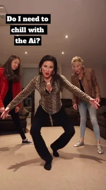 Three women perform a synchronized dance routine in a living room. The central dancer wears a leopard print blouse, while another sports a vibrant red jacket. They execute energetic moves, including pointing gestures and dynamic poses, all set to a hip-hop track. by @uk-gos with Original Sound by Contains: Layoo - Killamoe