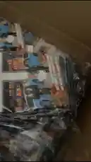 This close-up video shows a person unboxing a new t-shirt. The shirt features a graphic design with a blue car and the text 'YORKSHIRE BOYS'. It is being removed from its clear plastic packaging inside a cardboard box, revealing the full design. by @pack.d with Ski Talk by D-Block Europe