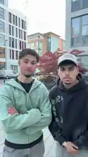 Two young men, one identified as Bobby, enjoy a casual walk through a modern city plaza. They share a friendly conversation before breaking into a synchronized dance routine. The scene captures their playful energy against a backdrop of contemporary architecture and urban greenery. by @bobix_s with bobix_s by Contains: Six Seven - Laurinha Costa, Dj Cabello, Dj Tchouzen, SoundMusic Original