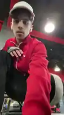 Watch a focused young man in a red hoodie and white cap perform a leg press exercise with heavy weights in a well-equipped gym. The scene captures his strength and dedication during a serious workout session. by @by.sul with by.sul by Contains: TEFLON JAM SESSION MIX - Kollision Band