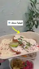 A close-up showcase of a healthy meal from Proteinz, featuring breaded chicken topped with creamy sauce and herbs, served alongside mashed potatoes and a side salad. The dish is presented in a takeaway container, highlighting a convenient and nutritious option. by @proteinz_sa with original sound