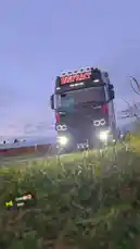 Witness Zagvik's impressive black Scania truck with 'INNFRÄKT' branding as it powers through a rural landscape during a breathtaking golden hour sunset. This cinematic shot captures the raw power and sleek design of the heavy-duty vehicle from multiple angles. by @zagvik with Siren🌄🤩 by Jolmh