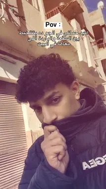 This POV clip captures the relatable moment of being late for a date while dealing with extreme heat. The creator, wearing a black quilted jacket and a scarf pulled up over their mouth, looks stressed and flustered. Arabic text overlays add context, setting the scene of rushing to meet someone. It's a short, authentic slice-of-life moment about the pressures of modern dating. by @sofaa_66 with sofaa_66 by Original Sound