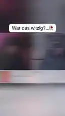 This live stream captures a moment of surprise and humor during a Valentine's Day-themed interaction. The scene opens with a split-screen view of two individuals, one in a dimly lit room with pink lighting and another in a well-lit space. The person on the left, wearing a black hoodie and beanie, appears to be reacting to something off-camera, while the person on the right, dressed in a dark jacket and headphones, gestures animatedly. As the clip progresses, the focus shifts to the individual on the left, who seems to be laughing or smiling. The atmosphere is light-hearted and playful, suggesting a casual and fun exchange. The video then transitions to a promotional graphic featuring a woman with long hair and a man in a black hat, accompanied by text that reads 'Valentine's Date?' and 'VID AUF YT,' indicating a call to action for viewers to watch more content on YouTube. The overall tone of the video is upbeat and engaging, designed to entertain and connect with an audience interested in lifestyle and relationship content. by @chris.lvu with chris.lvu by Original Sound