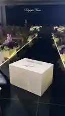 This elegant video captures the beautiful details of wedding preparations. It begins with a 'Bride to be' gift box, then reveals a stunning white wedding dress. The scene transitions to a beautifully styled vanity table adorned with candles, perfume, a ring box, and handwritten notes, all set against a backdrop of soft lighting and floral arrangements. by @me_ha73 with Original Sound by me_ha73