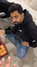 This video shows a group of people enjoying food together in a living room setting. One person holds up a blue point-of-sale (POS) terminal, demonstrating its use. The scene captures a casual social gathering with a focus on the interaction with the payment device. by @d7oomysnap with d7oomysnap by Original Sound