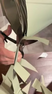 This video provides a detailed look at the art of gift presentation, focusing on a beautiful bouquet of white roses and gerberas. It begins with the unboxing process, revealing the fresh flowers wrapped in elegant sage green paper and tied with a delicate white ribbon. The final scenes showcase the completed arrangement placed on a rustic wooden table next to a bamboo plant, highlighting its aesthetic appeal as a thoughtful and sophisticated gift. by @gift_arts1 with gift_arts1 by Original Sound