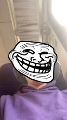 Preview for a Spotlight video that uses the Troll Meme Face Lens