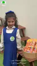 This cheerful video captures a special moment at Al Faisal Private Schools during International Women's Day. A young girl in her school uniform stands proudly beside a basket filled with watercolor paint sets. She is joined by other students who gather around, sharing the supplies with smiles and laughter. The scene beautifully illustrates themes of friendship, generosity, and the celebration of women, all within the vibrant setting of a school garden. by @ajyalf with Original Sound by ajyalf