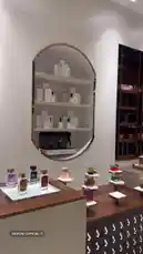 Explore the elegant interior of Alifraa, a high-end perfume boutique. This tour showcases their extensive collection of luxury fragrances, from classic bottles to modern designs, all displayed in a sophisticated setting with unique shelving and warm lighting. by @dalilnet with Original Sound by dalilnet