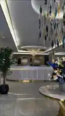 A stylish tour of the Armada Residence, showcasing its modern lobby with elegant chandeliers, a professional coffee bar where staff prepare lattes, and comfortable guest rooms with contemporary furnishings. This glimpse into the property highlights its sophisticated design and amenities. by @armadar25 with armadar25 by Original Sound