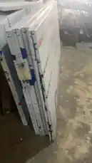 This behind-the-scenes look takes you inside a factory where stacks of SAP composite panels are prepared for distribution. A worker's hand points out details on the packaging, which features branding for 'SAP UM COMPOSITE PANEL' and 'SaudiAmericanPanel.com'. The video provides a close-up view of the industrial materials and processes involved in handling these construction panels. by @fula_kh with fula_kh by Original Sound