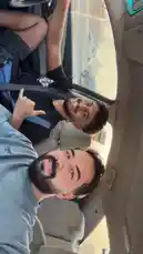 A behind-the-scenes look inside a car with friends enjoying a ride together. One person films a selfie-style video while another gives a thumbs-up from the passenger seat. The atmosphere is relaxed and friendly, with Arabic music playing in the background, creating a casual and fun vlog moment. by @mo_kbs8 with احلا صحبا يادونيا 🫵❤️❤️. by Contains: بحبك يا صاحبي - ِAhmed Saad Ali