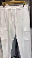 A stylish look featuring white linen cargo pants with a drawstring waist and large front pockets, paired with a relaxed-fit yellow button-up shirt. This casual-chic outfit is perfect for warm weather and showcases comfortable yet fashionable clothing options. by @code.a3 with code.a3 by Original Sound