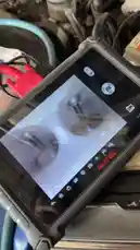 This close-up view shows a mechanic using an AUTEL brand handheld endoscope camera to inspect the internal components of an engine. The screen clearly displays the bores of the engine block, demonstrating a practical application for diagnosing wear, carbon buildup, or damage without disassembly. by @hawkar_service with Original Sound by hawkar_service