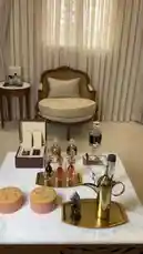 A beautifully arranged coffee and tea service setup is showcased in a luxurious living room. The scene features ornate glassware, a golden teapot, and elegant pastries on a marble coffee table, creating a sophisticated and inviting atmosphere. by @bee.8907 with Original Sound by bee.8907