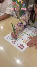 This vibrant video showcases children actively participating in diverse educational activities at Joy Destination Child Day Care Center. From indoor math exercises using colorful fruit illustrations to outdoor learning games involving numbers and symbols on artificial turf, the center emphasizes interactive play-based education. Children are seen assembling paper dolls, enhancing fine motor skills, while others engage in joyful physical activity. These scenes highlight a nurturing environment focused on holistic development through fun and creativity. by @joy_destination with joy_destination by Original Sound