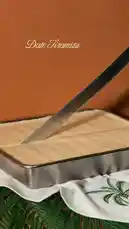 This video demonstrates the proper technique for cutting a tiramisu cake, focusing on achieving clean, even slices. It features a close-up view of a knife being used to cut through the layered dessert, resulting in a perfectly portioned piece served on a plate. by @fox_cofee with Original Sound by fox_cofee