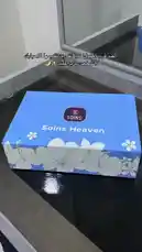 A detailed look at the unboxing of the SOINS Heaven fragrance set. This video showcases the elegant blue packaging, the main Eau de Parfum bottle with its distinctive light blue cap, and the accompanying 'Heaven Touch' palm moisturizer. The hand-held presentation highlights the product design and branding. by @soins_sa with Original Sound by soins_sa