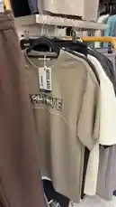 A stylish showcase of Kod Anqati's new streetwear line, featuring a variety of oversized graphic t-shirts in neutral tones like beige, black, and white. The collection highlights bold typography, including 'BELIEVE' and 'MUST SEY', with a focus on relaxed fits and modern casual wear. This lookbook-style presentation is perfect for anyone seeking trendy, everyday fashion. by @code.a3 with original sound