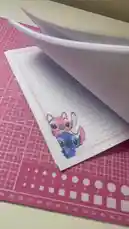 Discover this charming Stitch-themed notebook from Ruba | قرطاسية سما ⭐️. Watch as the cute pink and blue alien character is showcased on lined paper, perfect for fans of Disney's Lilo & Stitch looking for unique stationery. by @rubaaomaar with original sound