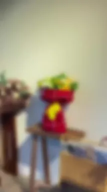 This visually appealing video showcases a curated gift display featuring two distinct floral arrangements. It begins with a vibrant bouquet of yellow sunflowers, white roses, and greenery wrapped in red plaid paper with a bright yellow bow. The scene then transitions to a charming teddy bear holding a smaller, elegant bouquet of white alstroemeria and lilies. The presentation is styled for aesthetic appeal, highlighting creative ways to present flowers as gifts. by @gift_arts1 with gift_arts1 by Contains: أجمل فرحة - Maha Ftouni