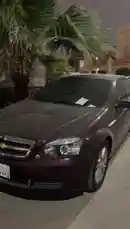 This nighttime video shows a dark-colored car covered in hailstones after a storm. The camera provides a detailed close-up of the hail damage on the hood and roof, highlighting the impact points on the vehicle's surface. by @khllo17 with Original Sound by khllo17