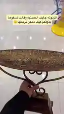 This video showcases the unboxing of a beautifully arranged chocolate gift basket from Brown Chocolate. It features a decorative bronze stand filled with golden-wrapped chocolates, elegantly tied with a white ribbon and topped with a fresh white rose. The scene transitions to reveal the full presentation, highlighting its suitability as a gift. Text overlays provide contact information for placing orders, emphasizing the brand's customer service. by @ch11.30 with original sound