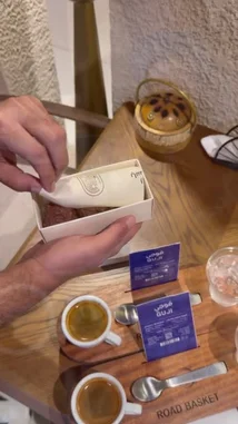This video takes you inside Road Basket, a modern coffee shop, showcasing their stylish interior, a professional espresso machine in action, and a close-up of a delicious-looking chocolate truffle. It's a sensory journey into the world of specialty coffee. by @power.ch01 with Original Sound by power.ch01