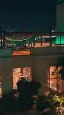 Experience the vibrant nightlife of Al Jubail from an elevated perspective. This cinematic night shot captures illuminated outdoor dining areas, bustling rooftops adorned with string lights, and the warm glow of city life, all set to a traditional musical soundtrack. by @dalilnet with 🎵 by Civ-s