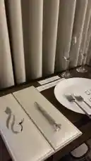 This stylish table setting showcases modern elegance perfect for weddings, anniversaries, or romantic dinners. Featuring a pristine white plate with personalized Arabic calligraphy, crystal-encrusted cutlery, champagne flutes, and custom place cards, it's a beautiful example of sophisticated event decor. See how to create a memorable dining experience. by @r200an with original sound