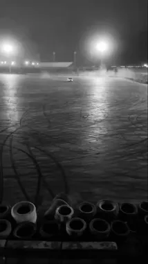 Witness an exhilarating display of nighttime drifting as a white pickup truck skillfully slides across a wet, illuminated track. The high-contrast black-and-white footage captures every spray of water and tire mark, creating a dramatic and cinematic scene perfect for car enthusiasts. by @zf_v81 with Original Sound by zf_v81