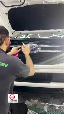Watch as Armor On demonstrates the professional installation of chrome grille trim on a white Ford vehicle. This detailed tutorial covers preparation, precise application using heat tools, and the final reveal, showcasing the enhanced front-end aesthetics. Learn the process for upgrading your car's look. by @armoronn with Original Sound by armoronn