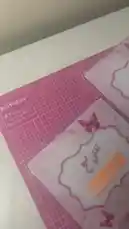 This video showcases a collection of personalized Arabic school notebooks from Ruba's stationery line, 'قرطاسية سما'. Each notebook features a unique theme, including Hello Kitty, Cinnamoroll, Ben 10, Spider-Man, and more, all customized with Arabic text labels like 'محمّد الزبيدي' and 'نجم الزبيدي'. The camera pans across these colorful and character-filled spiral-bound notebooks, highlighting their vibrant covers and the creative process behind personalizing school supplies. by @rubaaomaar with Original Sound by Contains: Be My First One - TalkinToys
