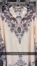 This video presents a curated collection of beautifully designed dresses, highlighting intricate embroidery, elegant patterns, and stylish details like buttons and tassels. Each garment features unique elements such as floral motifs and V-necklines, offering inspiration for those interested in fashion and clothing design. by @code.a3 with original sound